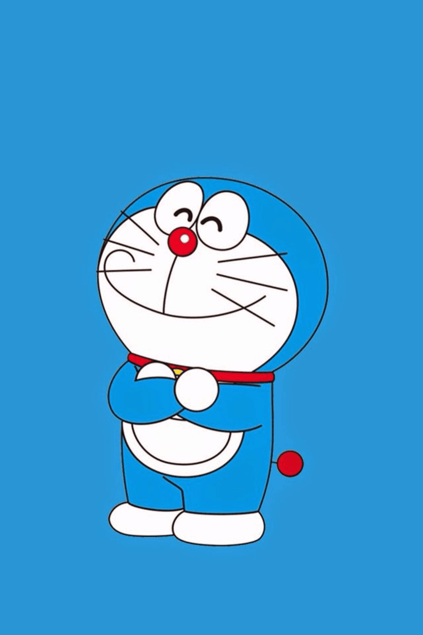 Doraemon the blue robot cat smiles broadly with closed eyes and clasped hands against a solid blue background.