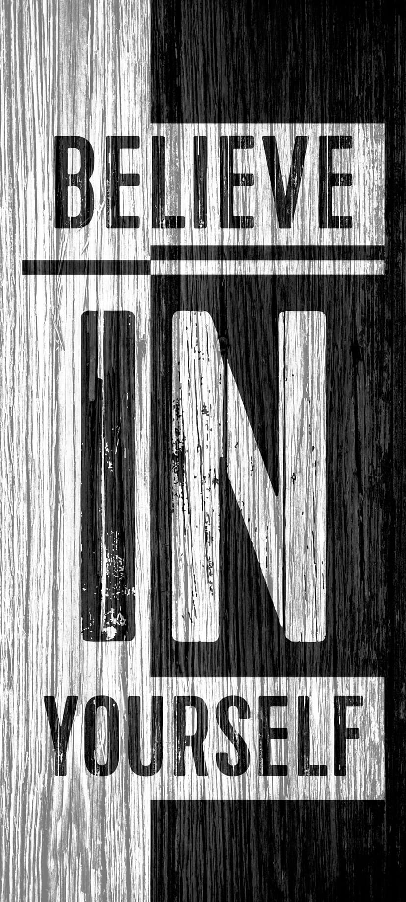 Believe in Yourself text centered on a weathered black and white wood plank background with visible grain patterns.
