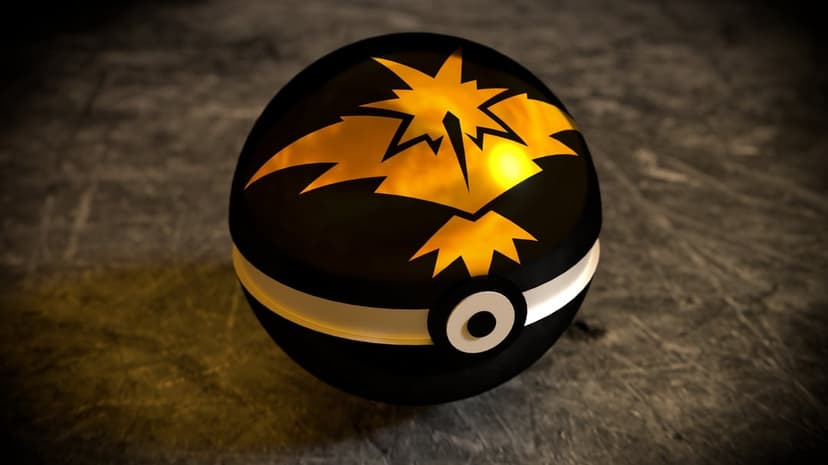 Black Poké Ball with a golden Zapdos emblem on a dark textured surface with warm yellow light reflections.