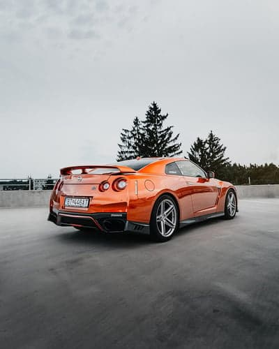 Vibrant Orange Nissan GT-R Rear View Mobile Wallpaper