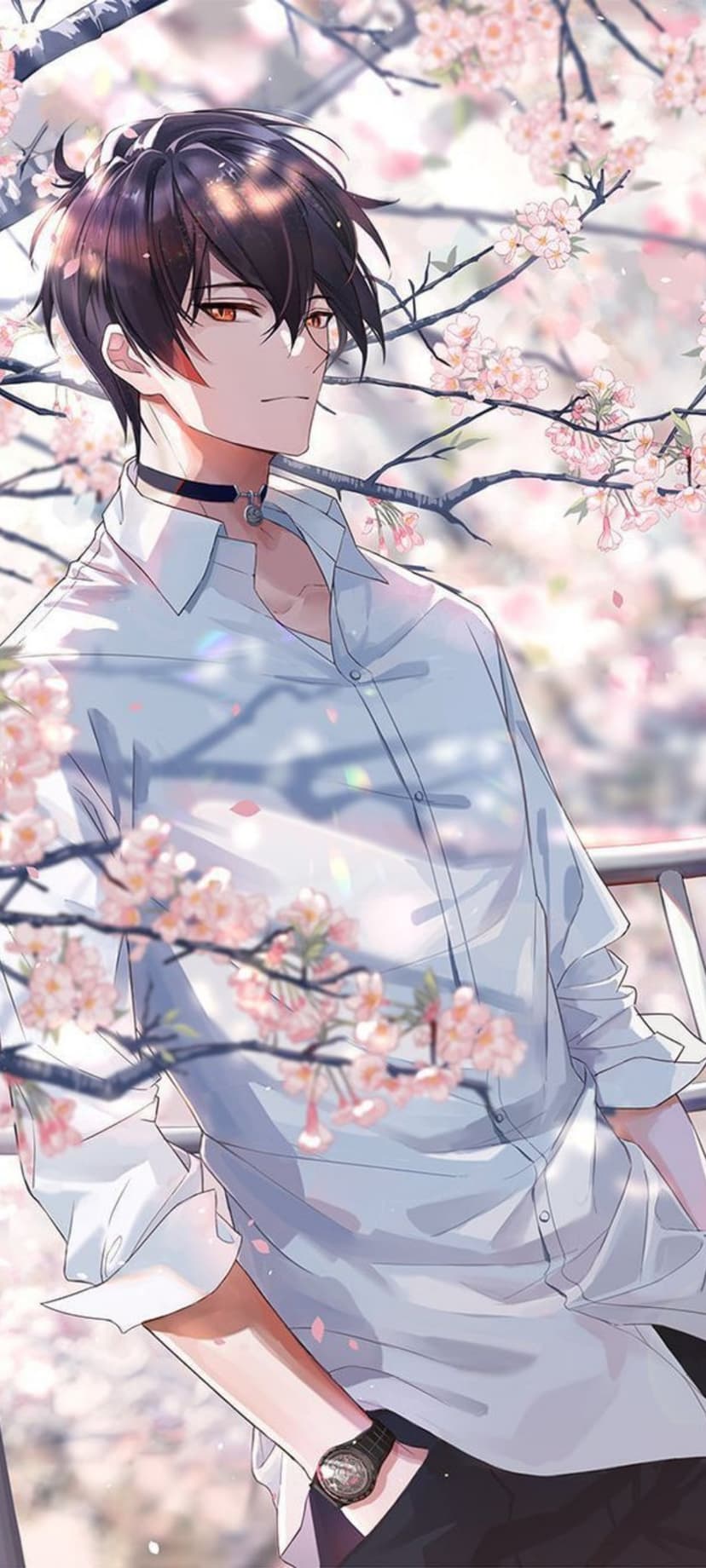 Young man with amber eyes and dark hair wearing a blue shirt and black choker surrounded by pink cherry blossoms.