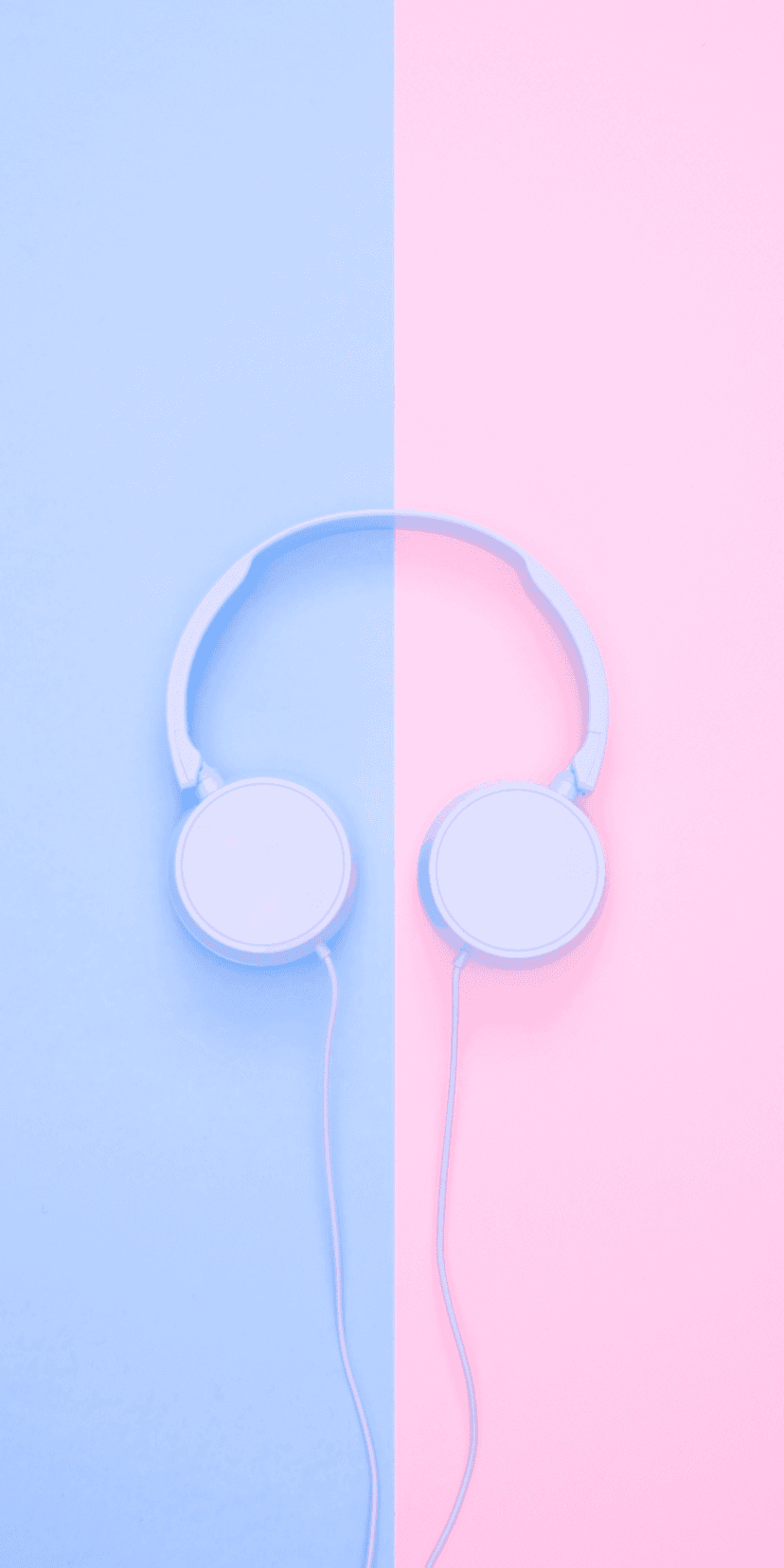 Light blue over-ear headphones centered on a vertically split background of pastel pink and soft baby blue.