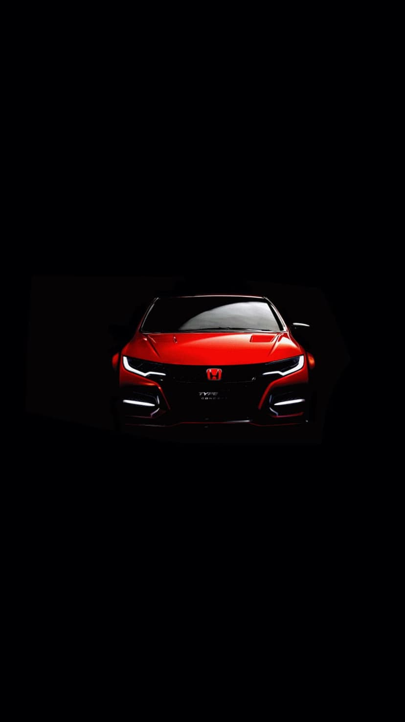 Red Honda Civic Type R front grille and LED headlights illuminated against a solid black background.