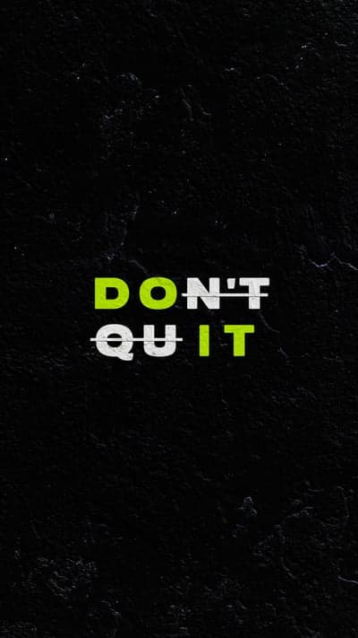 Motivational "Don't Quit" Text on Dark Textured Background