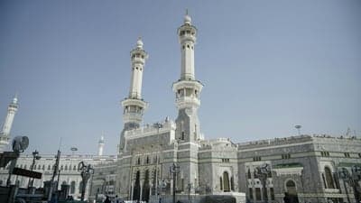 Masjid al-Haram and its iconic minarets under a clear sky