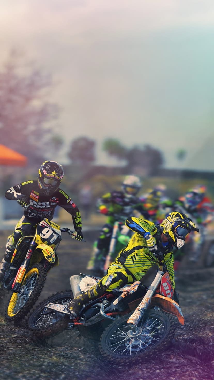 Lead motocross rider in yellow gear leans into a dirt track curve with blurred competitors trailing behind.