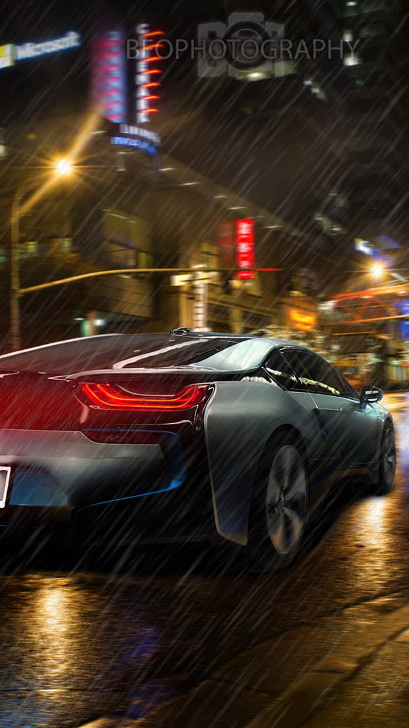 Modern sports car with glowing red taillights driving on a wet city street reflecting colorful neon lights at night.