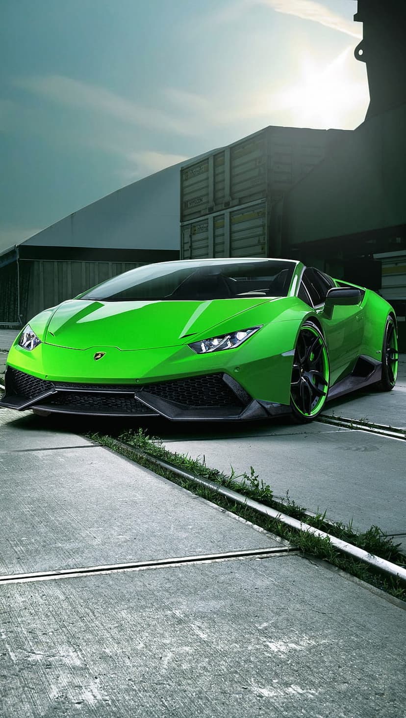 Lime green Lamborghini Huracan parked on concrete near shipping containers under a moody and overcast gray sky.