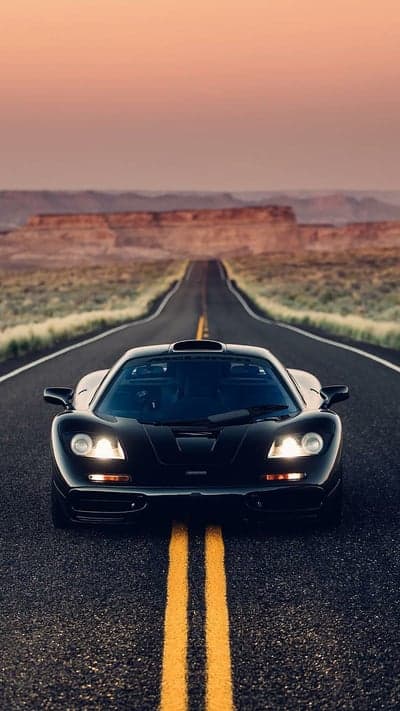 Black McLaren F1 on Desert Highway at Sunset