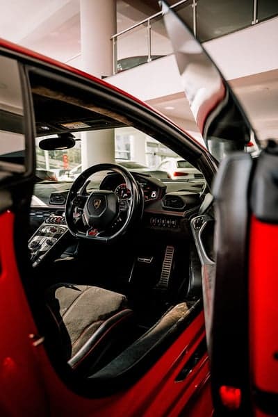 Interior View of Red Lamborghini with Open Door