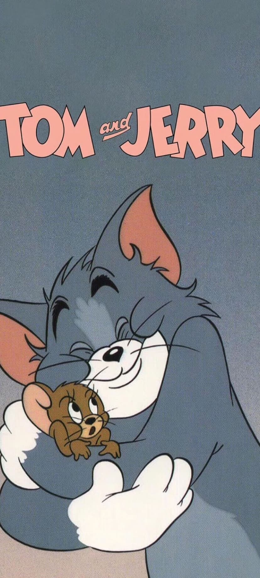 Tom the cat and Jerry the mouse embrace warmly with closed eyes in a sweet, animated friendship scene.