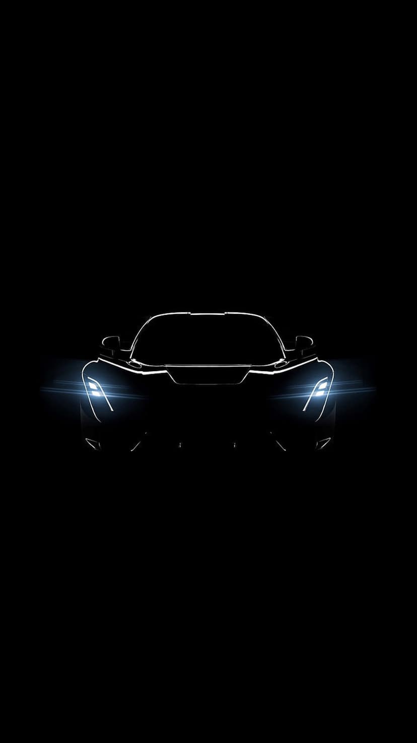 Futuristic sports car silhouette with glowing blue headlights and sharp aerodynamic lines on a black background.