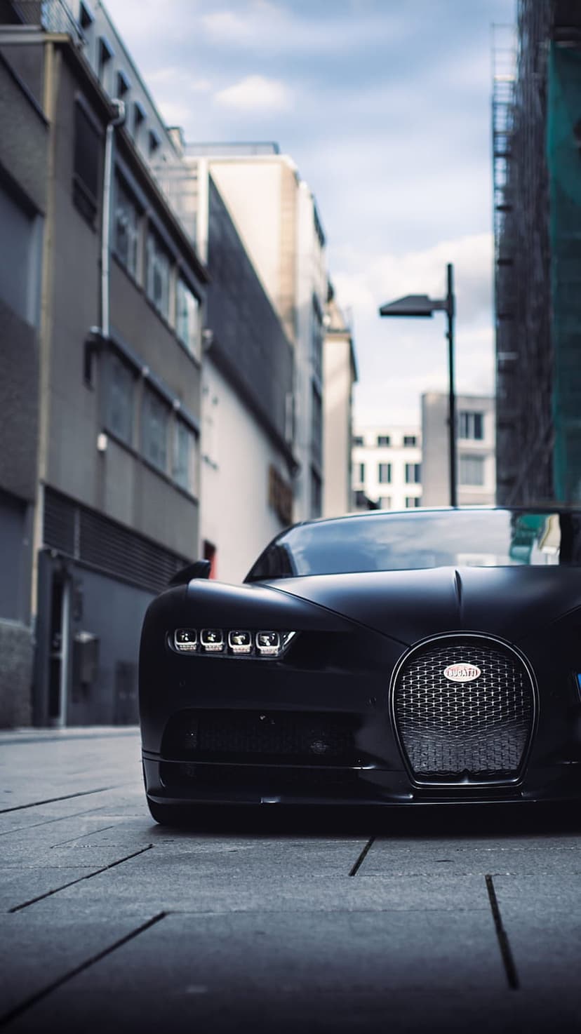 Sleek Bugatti Chiron Front View City Street Wallpaper