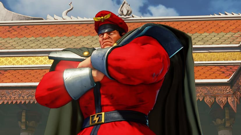 M. Bison from Street Fighter V in a red military uniform with crossed arms against a Thai temple background.