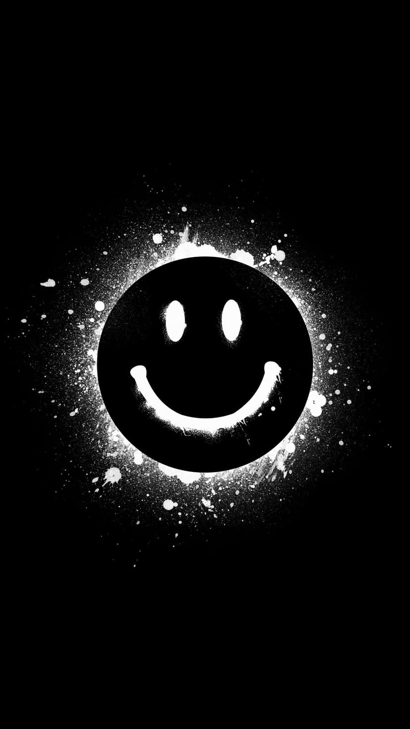 Graffiti smiley face with white paint splatters and drips on a solid black background for a high-contrast look.