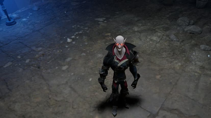 Pale bald vampire with glowing red eyes in black armor standing on a dark stone floor inside a cavern dungeon.