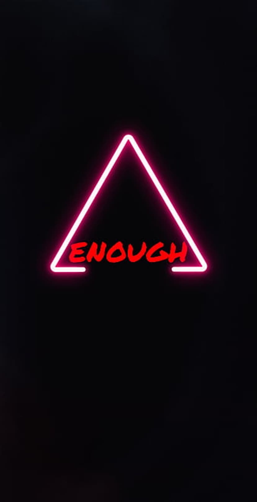 Pink neon triangle containing the word ENOUGH in distressed red font centered against a solid black background.