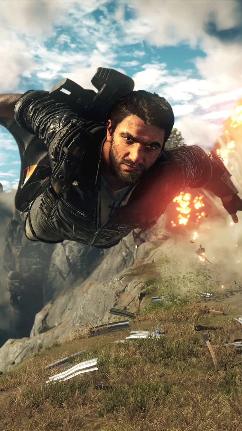Rico Rodriguez wingsuiting through the air with a massive explosion and rocky mountains in the background.
