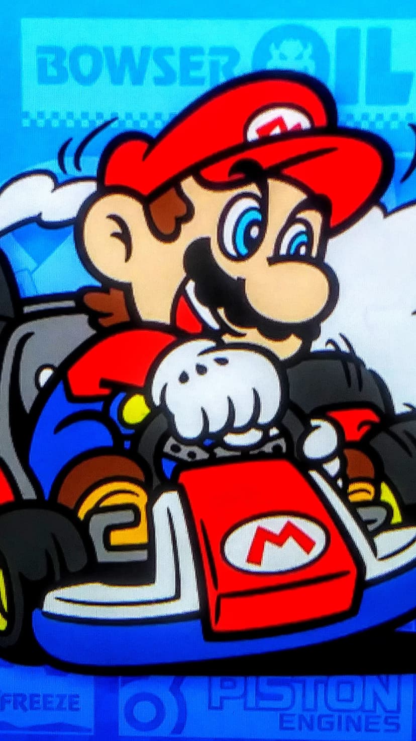 Mario drives a red racing kart inside a stone castle with the name Bowser glowing on a wall in the background.