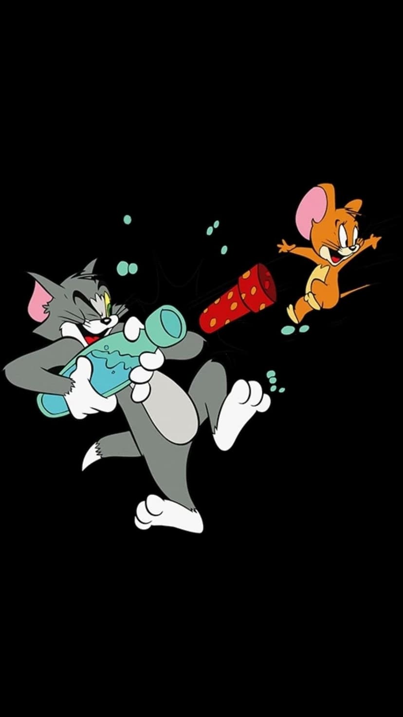 Tom the cat aims a water gun at Jerry the mouse near a red firecracker against a stark black background.