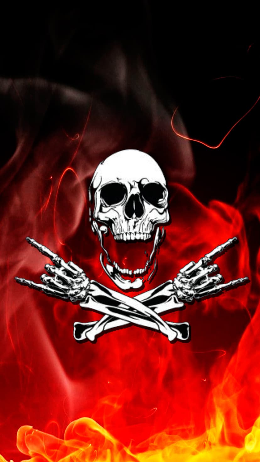 White skull with an open mouth surrounded by red fire and two skeletal hands making the rock on sign.