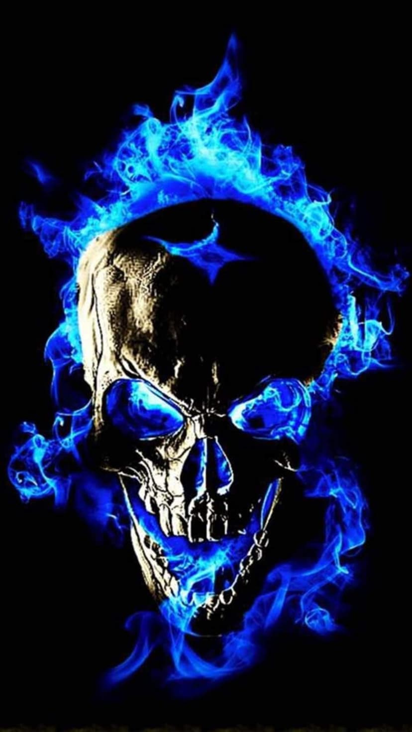 Human skull engulfed in swirling sapphire flames against a solid black backdrop with a ghostly blue glow.