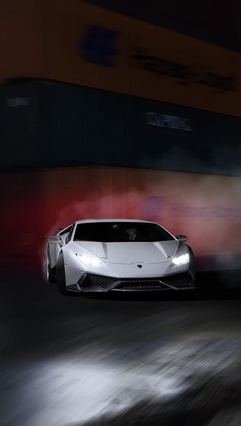 White Lamborghini drifting through thick smoke with red and blue neon lighting in a dark industrial setting.