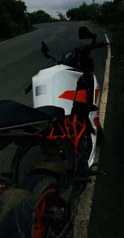 KTM RC 200 motorcycle parked on a winding road