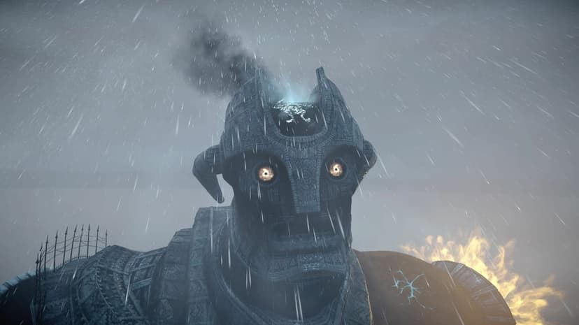 Stone colossus with glowing eyes and smoke rising from its head stands in a heavy rainstorm with distant fire.