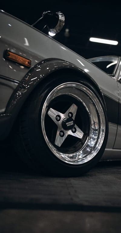 Classic Chrome Wheel & Grey Fender Portrait Wallpaper