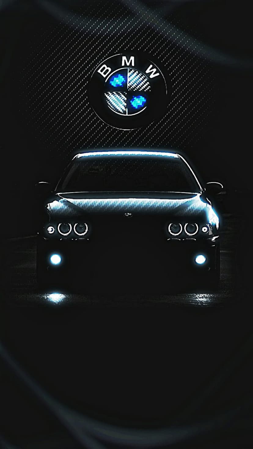 BMW angel eye headlights and a blue logo glow brightly against a dark car front and textured black background.