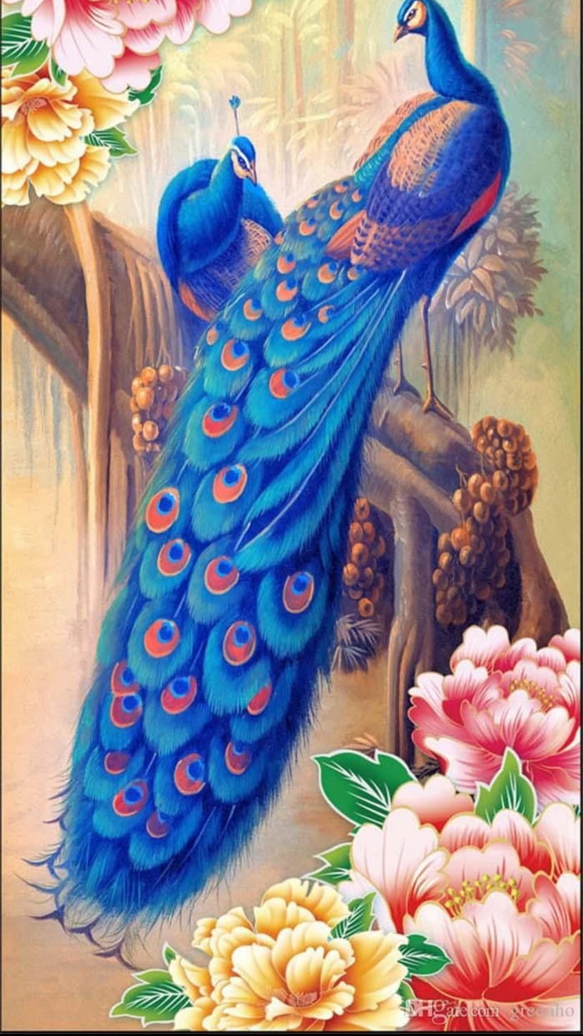 Two peacocks with iridescent blue tail feathers perched on a branch surrounded by pink and yellow peony flowers.