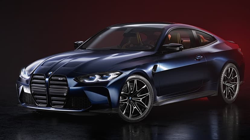 BMW M4 Competition in deep blue metallic on wet pavement with red studio lighting and sharp LED headlights.