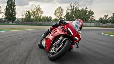 Red Ducati Panigale V4 Racing on Track Desktop Wallpaper