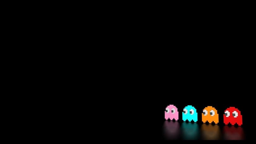 Four colorful 3D pixel art ghosts glowing on a black reflective surface in the bottom right corner.