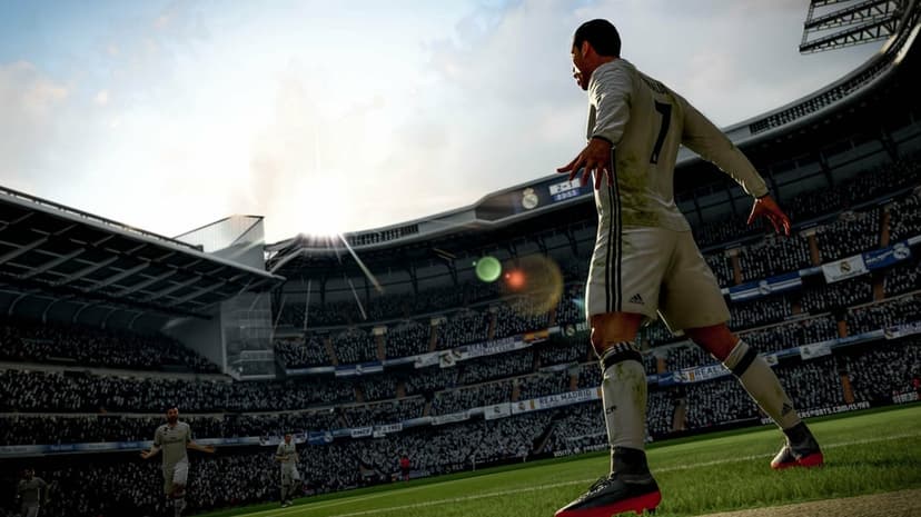 Cristiano Ronaldo in a muddy Real Madrid kit celebrates a goal under a bright sun at the Santiago Bernabéu stadium.