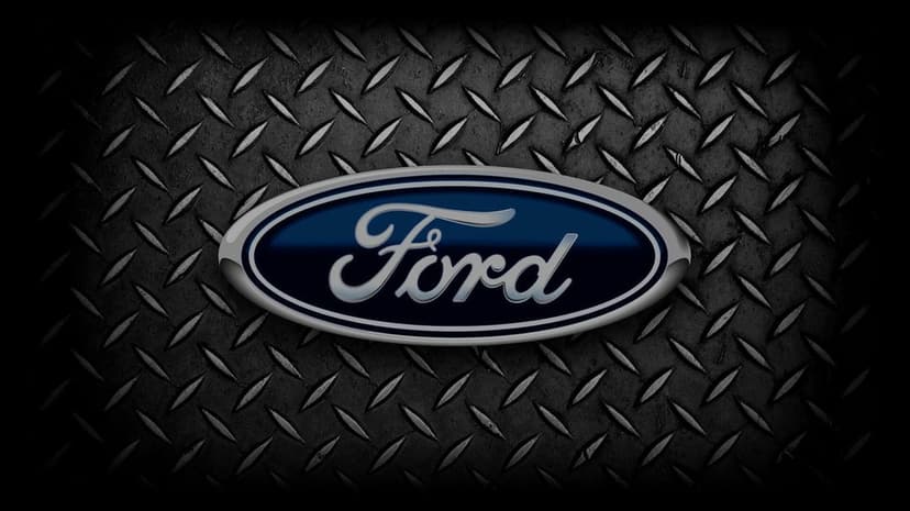 Ford logo with silver script and blue oval on a dark textured diamond plate metal industrial background.