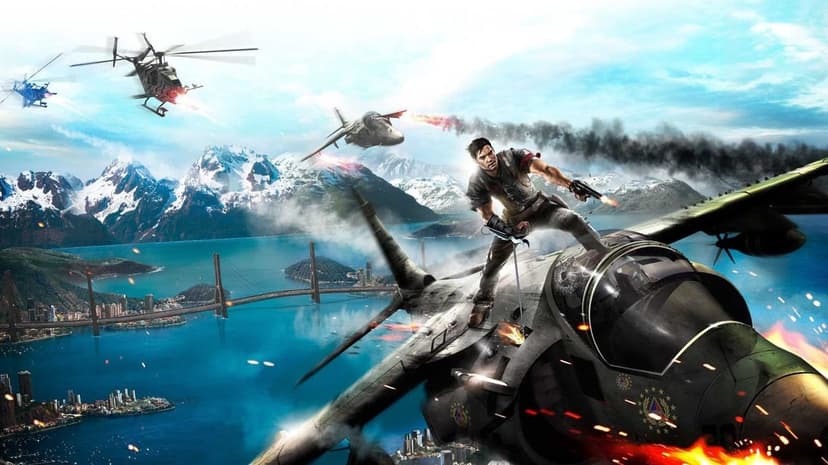 Rico Rodriguez stands on a flying fighter jet wing above a tropical island with helicopters and explosions.