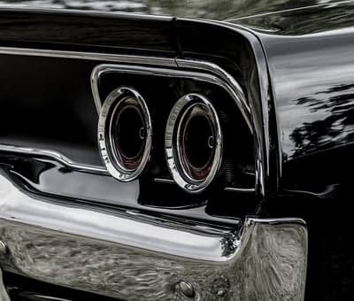 Vintage Black Muscle Car Tail Lights Mobile Background