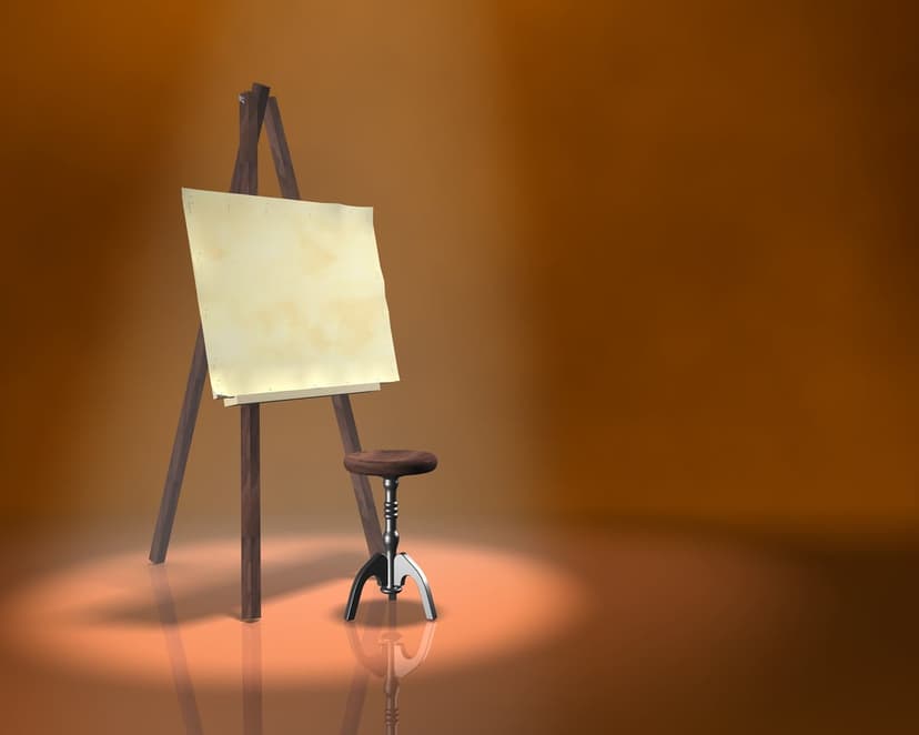 Wooden artist easel and stool under a bright spotlight against a warm orange gradient backdrop in a studio.