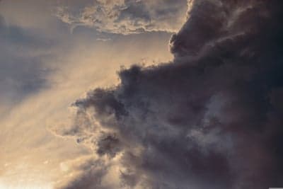 Dramatic Storm Clouds at Sunset with Golden Light