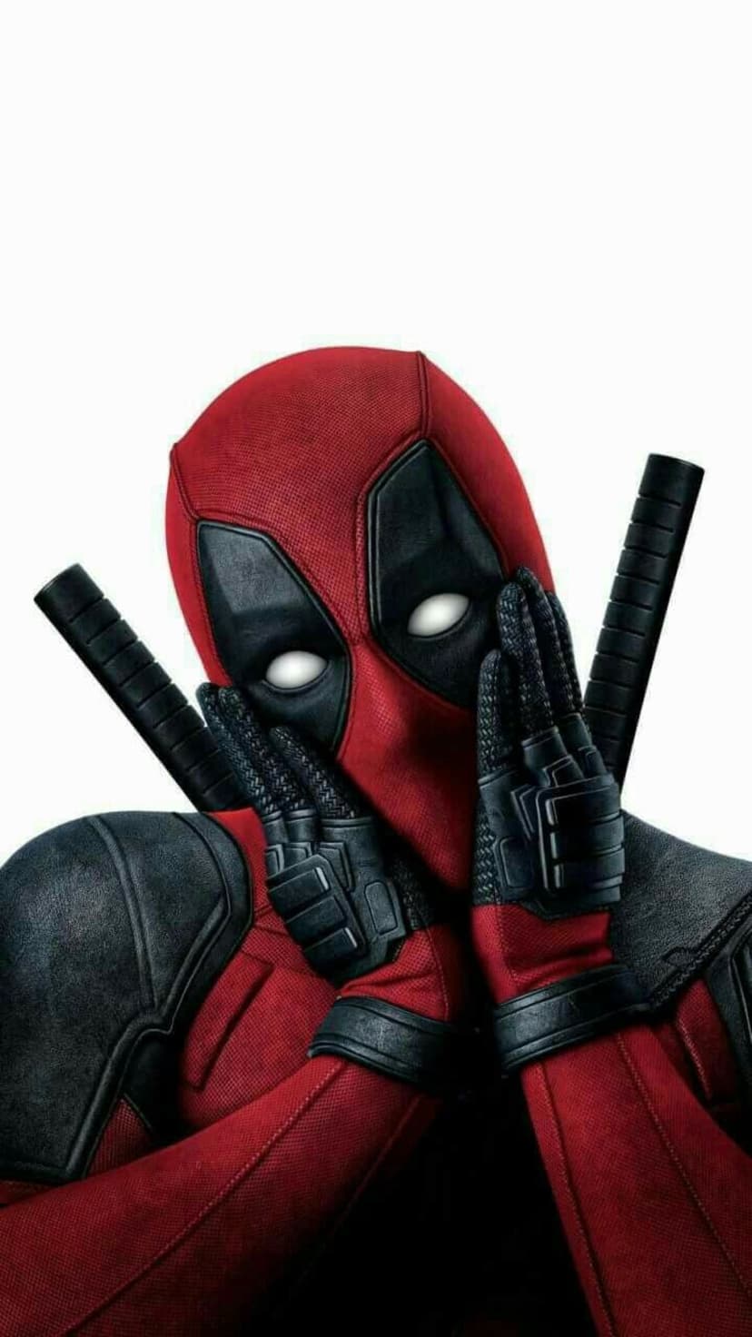 Deadpool covers his masked face with gloved hands while katana hilts rest on his back against a white background.