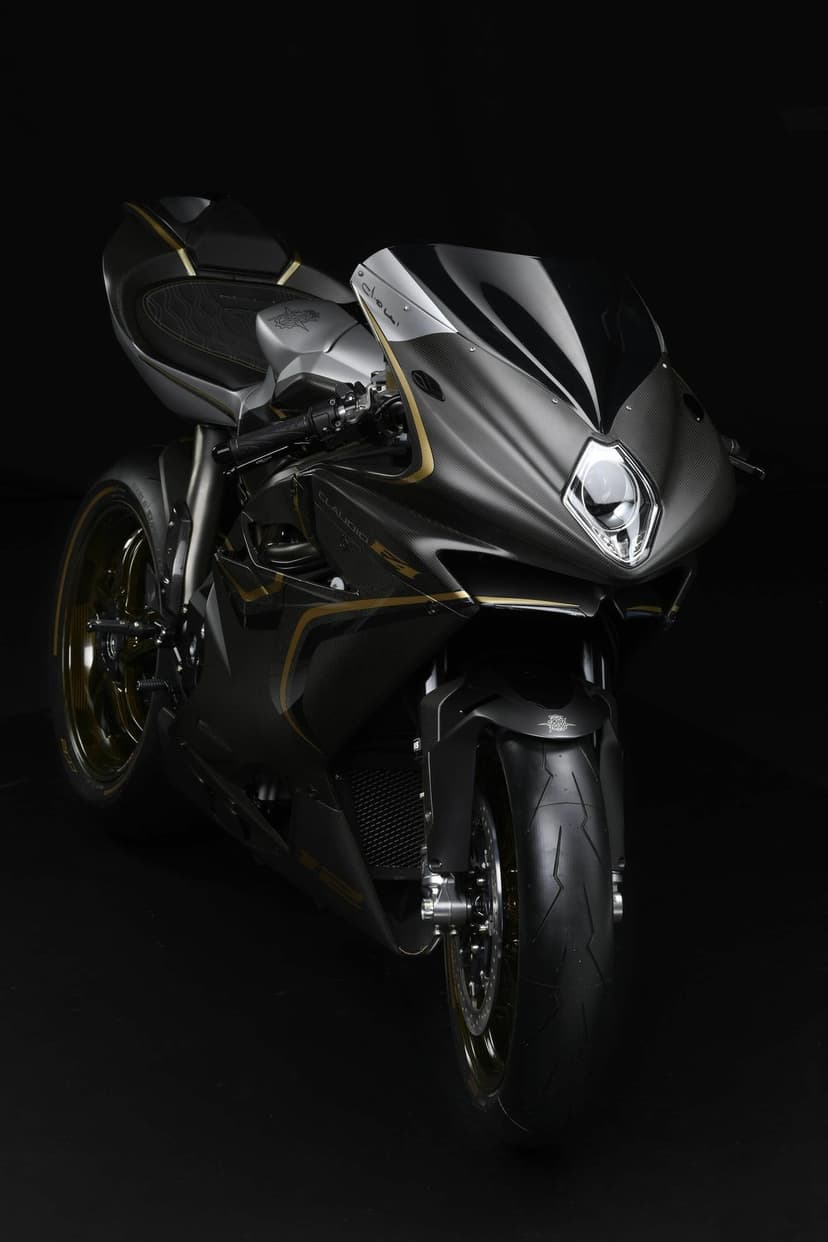 Front view of an MV Agusta F4 Claudio motorcycle with carbon fiber fairings and gold accents on black background.