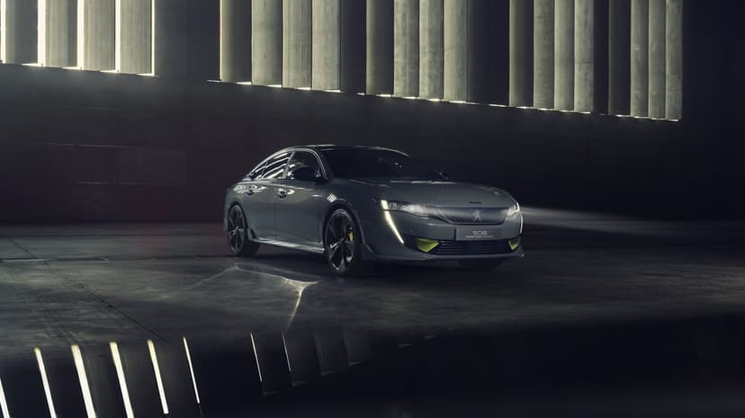 Dark gray Peugeot 508 sedan with lime green accents in a moody industrial studio with dramatic vertical lighting.