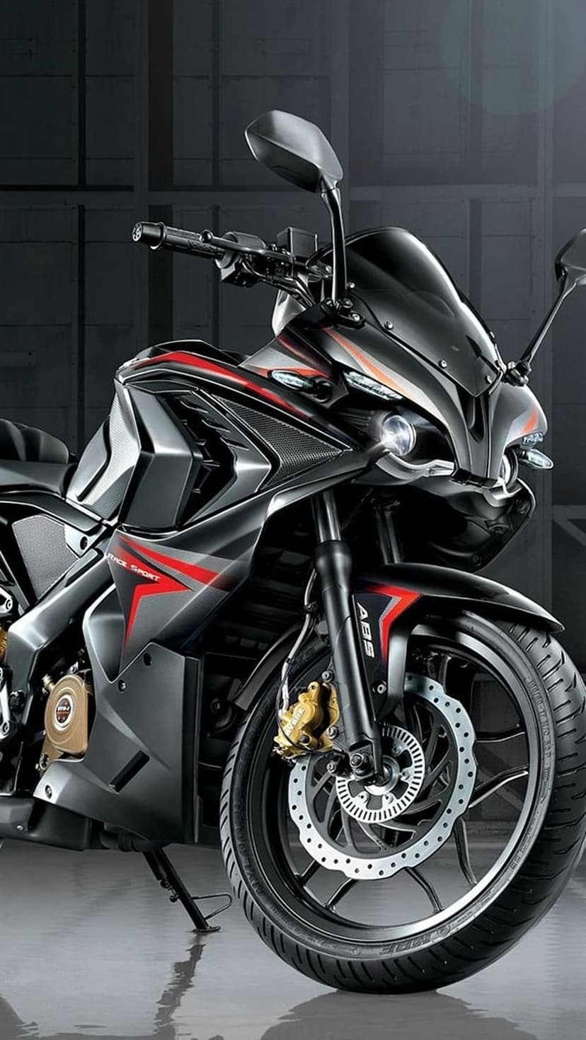 Sport motorcycle with matte black fairings and red accents features a projector headlight and disc brakes.