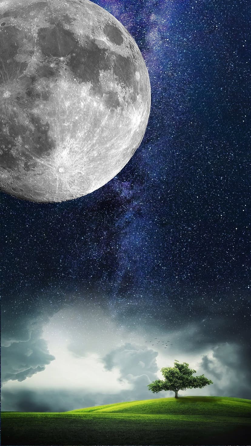 Colossal full moon shines over a lone tree on green hills beneath a starry sky with dramatic atmospheric clouds.
