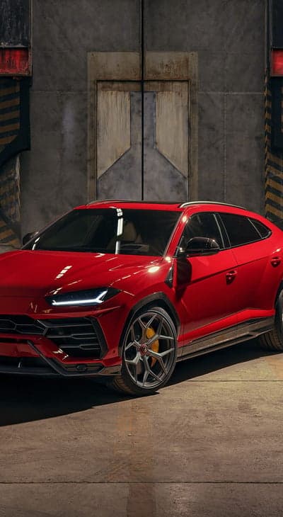 Crimson Lamborghini Urus SUV Urban Industrial Wallpaper