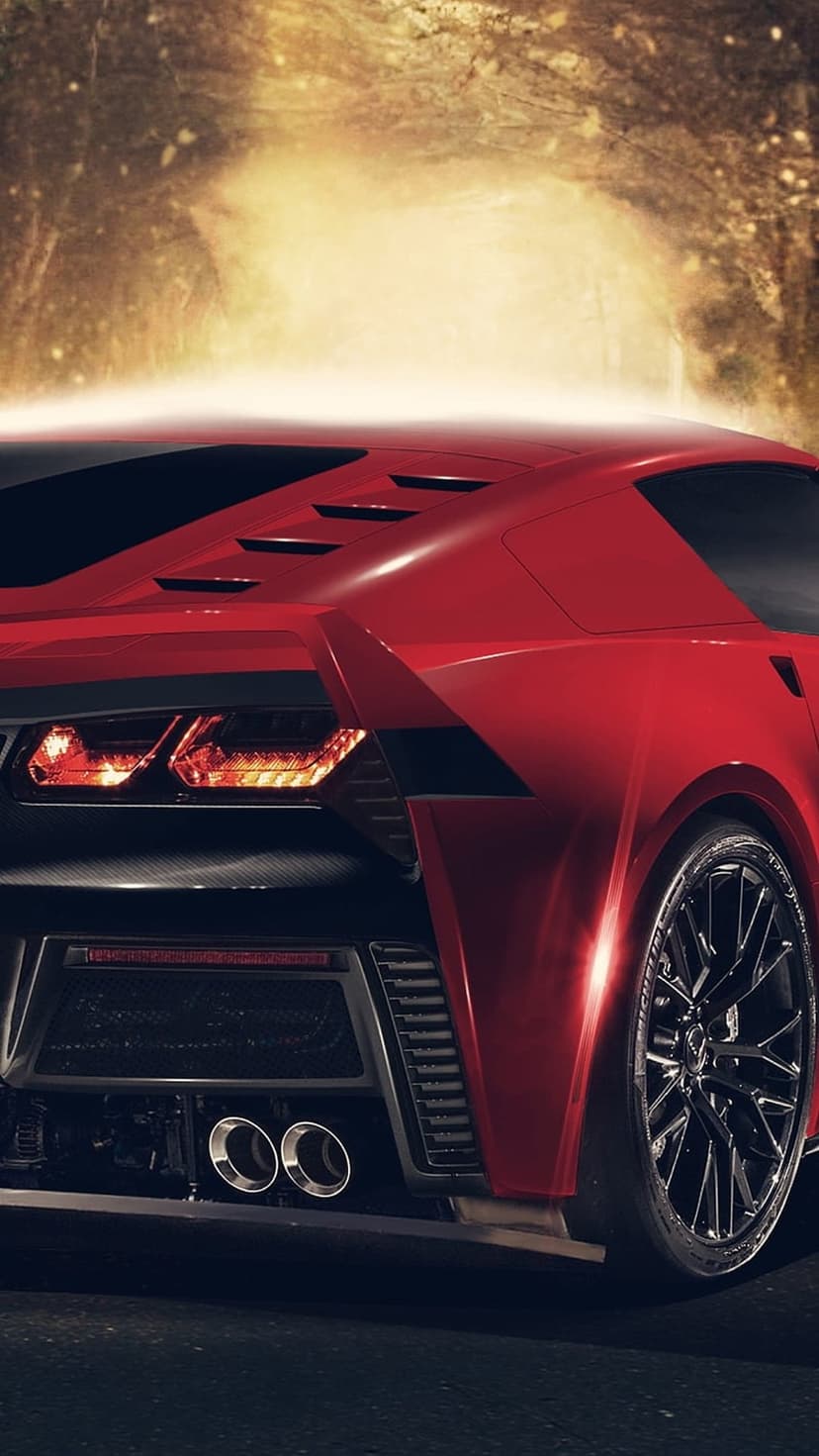 Red sports car rear with glowing orange taillights and dual exhausts in a blurred golden tunnel background.