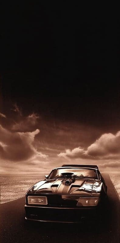 Mad Max Interceptor Car on Road Under Dramatic Sky