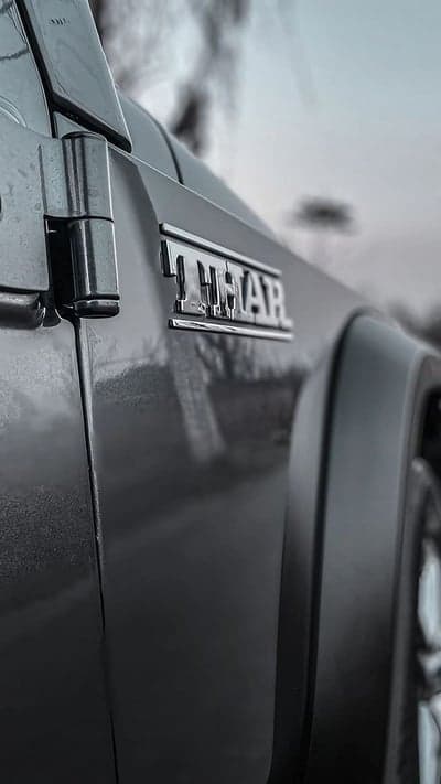 Rugged Mahindra Thar Chrome Badge and Steel Hinge Backdrop